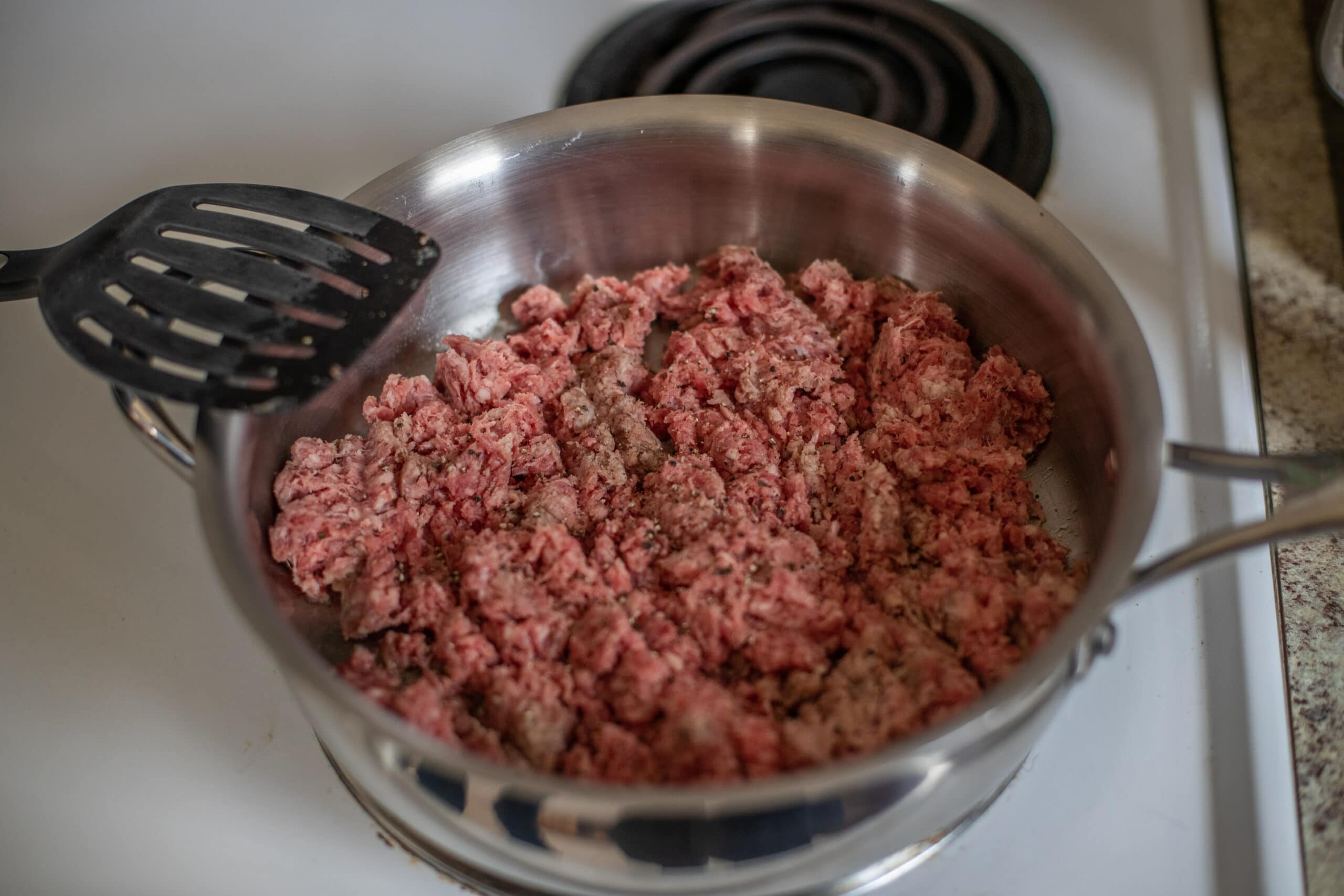 ground beef for the beef stroganoff recipe in the pan