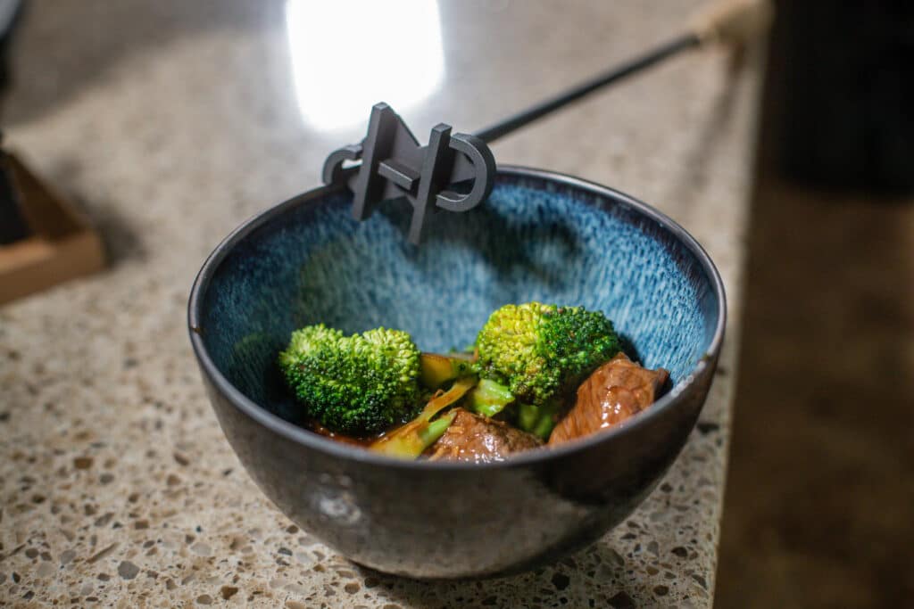 beef broccoli in a blue bowl